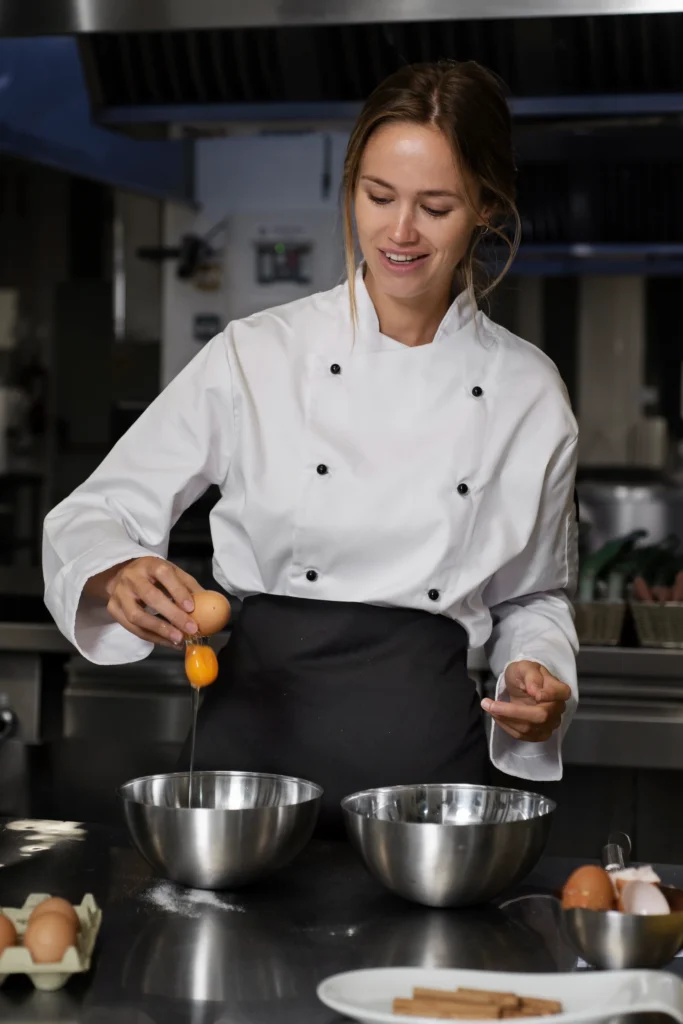 About me 1 female chef kitchen separating eggs bowl 2 11zon